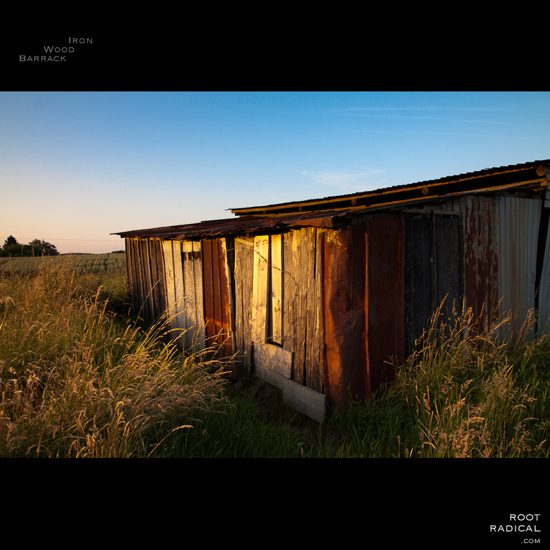 iron-wood-barrack An old hut made of iron & wood in a field