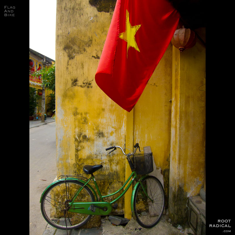 vietnam-flag-bike Vietnamese flag waving above an old bike.